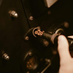 Detailed shot of fresh coffee beans being roasted, highlighting the artisan process.