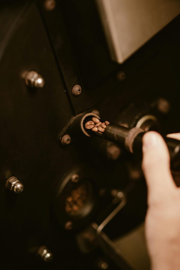 Detailed shot of fresh coffee beans being roasted, highlighting the artisan process.